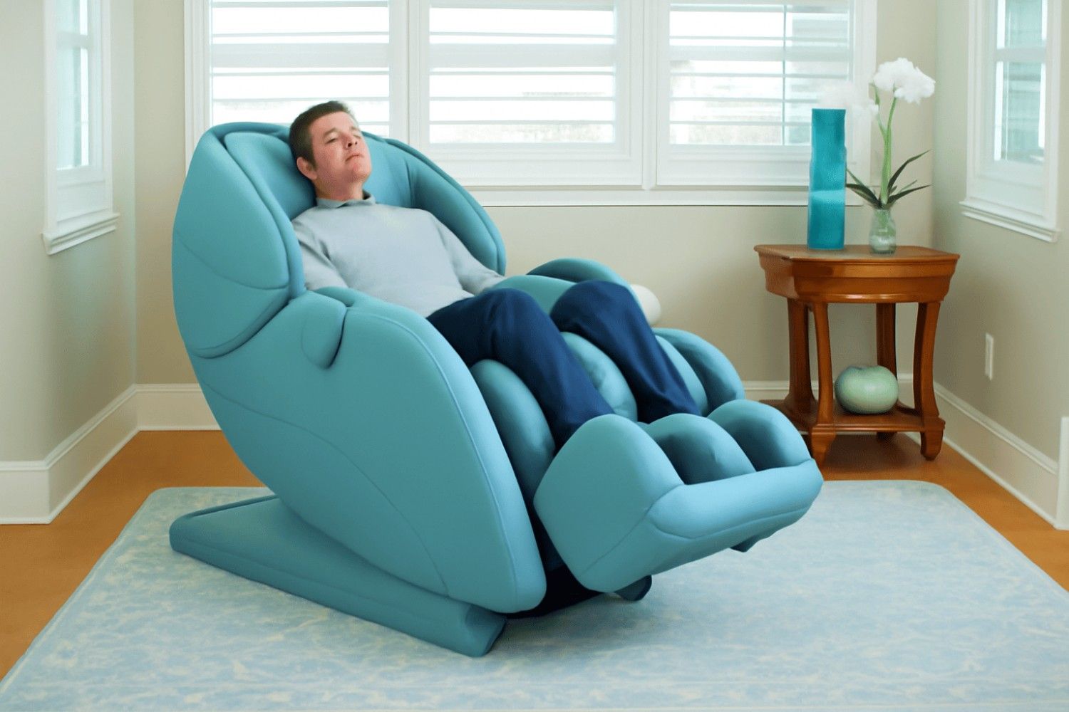 Modern wellness room design with light blue massage chair, wooden side table, neutral tones