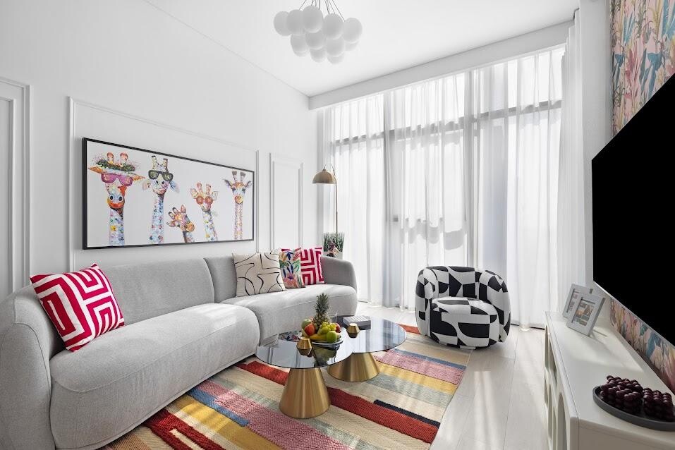 Modern design, playful living room, bright white and bold colours, giraffe art and patterned chair.