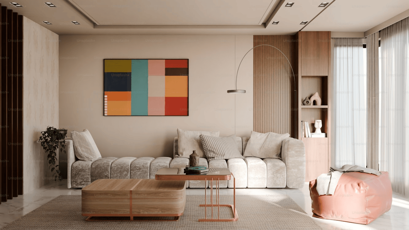 A modern warm toned setup using art and cosy textures to enhance the living room beautifully
