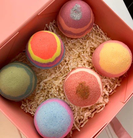 Six colourful fizzy bath bombs in a coral box perfect for Secret Santa Gifts Under 50 AED