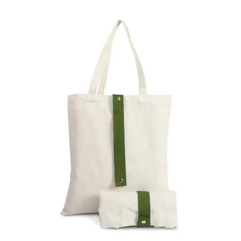 Cream canvas tote bag with green straps perfect for Secret Santa Gift Under 50 AED