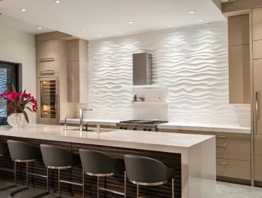 kitchen backsplash features textured 3D white wave tiles