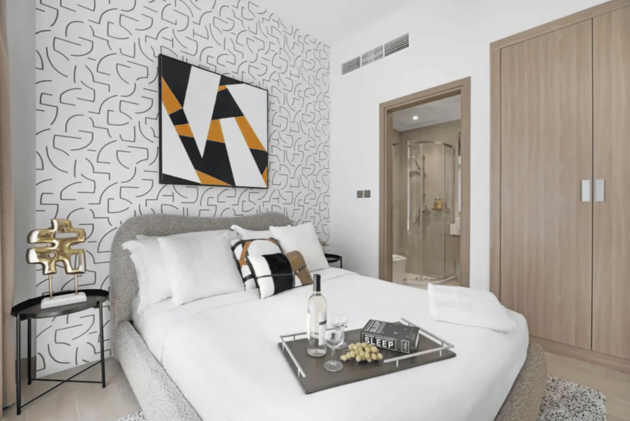 modern bedroom with bold geometric patterns and contrasting colors energizes the space and lifts your mood
