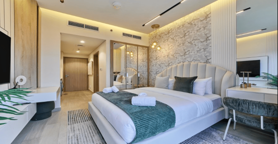 soothing bedroom with soft tones and green accents promotes relaxation and gently boosts your mood