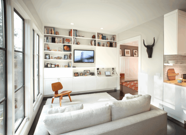 Maximised vertical space with wall mount shelves Modern Small Living room ideas