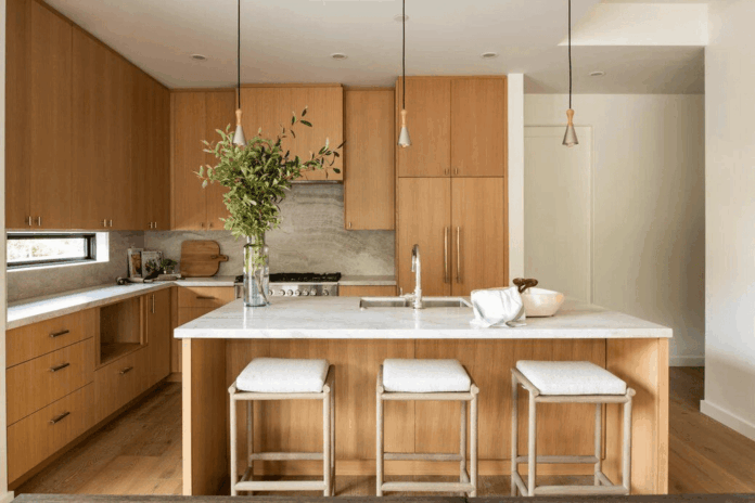 Japandi Kitchen Design in open kitchen layout featuring hidden hood vents